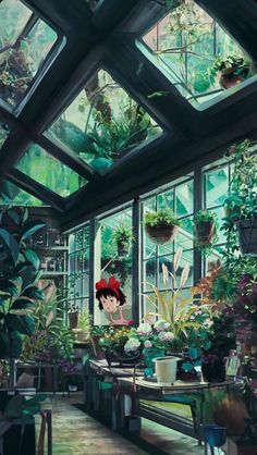 a room filled with lots of plants and potted plants