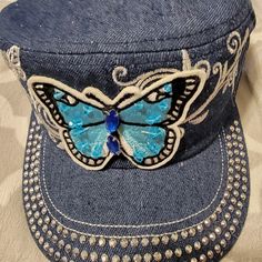 This Beautiful Butterfly Rhinestone Cadet Adjustable Cap Is One Size Fits Most Blue Adjustable Hat With Rhinestones, Adjustable Blue Hat With Rhinestones, Blue Rhinestone Hat For Summer, Blue Summer Hat With Rhinestones, Fedora Hat Style, Plain Baseball Caps, Floppy Straw Hat, Butterfly Rhinestone, Gardening Hat