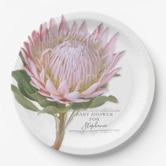 a paper plate with an image of a pink flower on the front and back of it