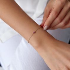 Our simple and elegant solitaire bracelet features a round cut natural ruby at its center. We can craft this bracelet in 14K or 18K Gold according to your preference.★ Bracelet Features• Gold Kt: 14K/18K Solid Gold (All pieces are stamped for authenticity)• Available Gold Colors: Yellow Gold, Rose Gold, White Gold• Center Round Cut Ruby Weight: 0.15 carat• We only work with real natural rubies• We offer a signed certificate with each bracelet for the authenticity of the center ruby stone.• Cente Solitaire Bracelet, Royalty Fashion, Solid Gold Bracelet, Ruby Bracelet, Rose Gold White, Gold Colors, Ruby Stone, Can Crafts, Natural Ruby