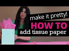 a woman sitting at a table with pink paper bags on it and the words make it pretty how to add tissue paper