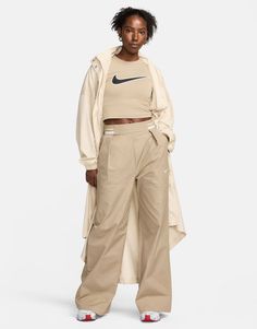 Leggings by Nike Make your jeans jealous High rise Elasticized waistband Side pockets Nike embroidery detail Wide leg Woven Nike Pants, Nike Two Piece Outfit, Beige Nike, Nike Embroidery, Nike Collection, Legs Outfit, Sporty Fashion, Winter Party Dress, Leggings Sale