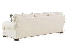 a white couch sitting on top of a wooden floor