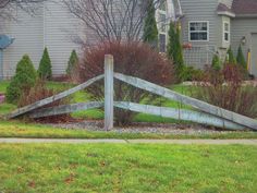 a wooden fence in front of a house