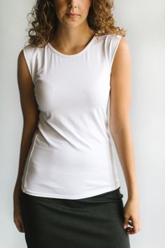 Exclusively ours, this layering tank is a must have staple for any closet! Designed with that hard to find 'perfect' neckline and full shoulder coverage, this tank layers well with any top that might need just a bit more coverage. Proudly made right here in Lancaster County, we chose a high quality jersey fabric that holds it's color and maintains it's shape after repeated washings! This has become a personal favorite and we think it will soon become yours as well! 98% Rayon/8% Spandex Made in t Modest Denim Skirts, Dark Denim Skirt, Layering Cami, Corduroy Overall Dress, Layering Tank Tops, Lancaster County, Modest Clothing, Layering Tanks, Basic Outfits