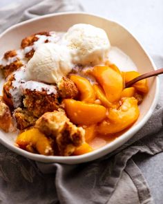 a bowl filled with fruit and ice cream