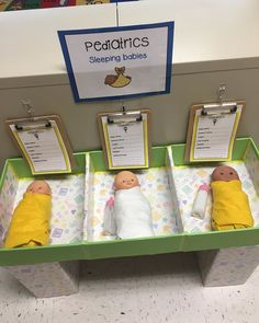 there are three baby dolls on display in the toy store's changing table area