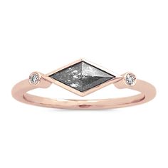 This beautiful ring is a masterpiece of craftsmanship  featuring a kite-shaped natural pepper diamond and a pair of classic natural diamond accents  all set in romantic 14-karat rose gold. It makes a unique gift or a beautiful treasure for yourself. Trillion Cut Ethical Diamond Ring In Rose Gold, 14k Rose Gold Diamond Ring With Bezel Setting, Luxury Trillion Cut Rose Diamond Ring, Rose Gold Diamond Rings With Trillion Cut, Rose Gold Marquise Cut Diamond Ring With Single Diamond, Rose Gold Marquise Diamond Ring With Accents, Elegant Trillion Cut Diamond Ring With Rose Cut Diamonds, Elegant Trillion Cut Rose Diamond Ring, Elegant Rose Gold Trillion Cut Ring