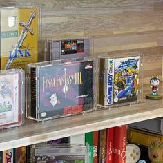 several video game cases on a shelf in a room with wooden shelves and bookshelves