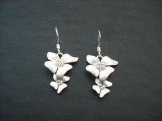 matte finish white gold plated over brass flowers, done with hand brush technique, hangs on a white gold plated ear wires earrings measure 20mm from ear wires matching bracelet; https://www.etsy.com/listing/87535808/fourfold-flowers-bracelet matching necklaces; https://www.etsy.com/listing/169941327/three-fold-flowers-cascading-necklace https://www.etsy.com/listing/87536182/matte-fivefold-flowers-lariat-white-gold https://www.etsy.com/listing/170930272/double-three-fold-flowers-with-swarovski al Delicate Silver Flower Earrings For Anniversary, White Sterling Silver Pierced Flower Earrings, Silver Flower Earrings With 3d Flowers For Gift, Silver Flower Earrings With 3d Flowers As Gift, Silver 3d Flower Earrings For Gifts, Sterling Silver Earrings With Flower Charm For Wedding, Silver Sterling Earrings With 3d Flowers, Sterling Silver Wedding Earrings With Flower Charm, Formal White Sterling Silver Flower Earrings