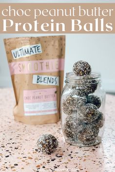 a jar filled with lots of different types of candies on top of a table