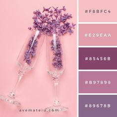 two wine glasses filled with purple flowers on top of a pink background and the words e2eaa, 854 - 666b