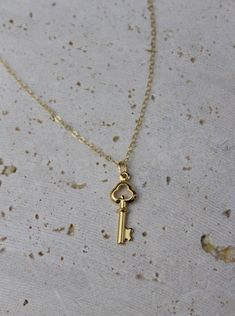 Meet Carolina, your next jewelry obsession. Its vintage key pendant is perfect for layering or wearing it by itself. MATERIALS & SIZE Material: 18k gold filled chain and 18k gold plated pedant Size: 16 in. chain Extender: 2 in. JEWELRY CARE Most of our jewelry is tarnish resistant, hypoallergenic, safe for sensitive skin. Handmade with ♡ in New York. - To maintain the beauty of your jewelry, whether it’s stainless steel, gold plated, or gold-filled, always avoid saltwater, chlorine (swimming poo Gold Key Pendant Jewelry, Gold Pendant Jewelry With Keys, Classic Jewelry With Keys For Gifts, Vintage Gold Key Necklace, Vintage Gold Necklaces With Keys, Vintage Gold Jewelry With Keys, Gold Brass Necklace With Keys, Vintage Key Necklace, Key Necklace Vintage