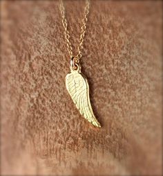 Tiny gold wing necklace - angel wing necklace - guardian angel wing - fairy wing - a gold vermeil wing charm on a 14k gold vermeil chain A super cute and tiny gold vermeil wing hanging peacefully from a 16 inch 14k gold vermeil chain. Perfect for layering! Please feel free to select a different length chain if you prefer. ♥ Need a super cute set of matching earrings? https://www.etsy.com/listing/481118655/gold-wing-earrings-tiny-wing-earrings Need an energy boost? You can also add a little tourm Yellow Gold Wing-shaped Necklace For Gift, Sterling Silver Gold Angel Wings Jewelry, Gold Sterling Silver Jewelry With Angel Wings, Gold Wing-shaped Sterling Silver Necklace, Angelic Gold Necklaces As Gifts, Angelic Gold Necklaces For Gifts, Angelic Gold Necklace For Gift, Gold Winged Sterling Silver Jewelry, Elegant Winged Gold Jewelry