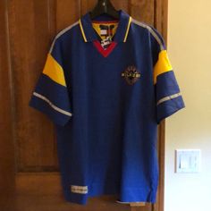 New With Tags Approx Measurements: Hem To Hem: 24.5” Chest: 24” Shoulder: 13” Sleeve: 8.5” (Width At Narrowest Point) Length 31.5” Vintage Blue Collared T-shirt, Blue Polo Collar Top For Streetwear, Retro Blue Polo Collar T-shirt, Tommy Hilfiger Blue Collared Shirt, Blue Collared Tommy Hilfiger Shirt, Fitted Blue Tommy Hilfiger Shirt, Tommy Hilfiger Blue Short Sleeve Shirt, Tommy Hilfiger Blue Short Sleeve Tops, Tommy Hilfiger Blue Relaxed Fit Top