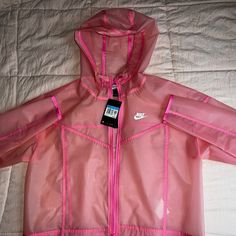 Never Worn, Still Has Tag! It Is A Size Medium In Woman’s Pink Sportswear For Light Sports, Pink Sporty Activewear For Light Sports, Sporty Pink Activewear For Light Sports, Pink Winter Sportswear Activewear, Hooded Nylon Running Outerwear, Hooded Nylon Outerwear For Running, Nike Athleisure Track Jacket For Workout, Pink Winter Athleisure Activewear, Pink Long Sleeve Activewear Sportswear