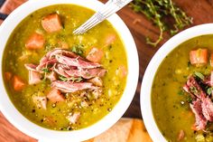 two bowls of soup with meat and vegetables