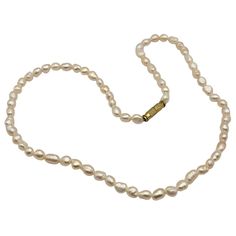 Timeless freshwater pearl necklace, featuring lustrous pearls and a gold-tone clasp. Ideal for adding elegance to any outfit. * Freshwater Pearls * Gold Tone Clasp * Approximately 17 Inches * Classic Design * Elegant Gift Option Nice Estate Condition / As Found Stunning Fresh Water Baroque Pearl Necklace Secure Screw Clasp / Pearls 5.21 mm Approx. A Very Pretty Necklace For Any Occasion or Gift Pearl Necklace With Gold, Pretty Necklace, Baroque Pearl Necklace, Freshwater Pearl Necklace, Pretty Necklaces, Freshwater Pearl Necklaces, Baroque Pearls, Elegant Gift, Fresh Water