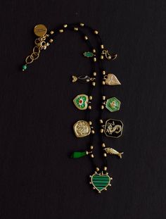 CHARM NECKLACE ON BLACK CORD DETAILS: * Charms: ELEVEN Gold plated charms. Malachite heart, Dragon, Fish, Bee,     Hearts, Fist, Hamsa, Moon. * Cord: Hand knotted on black cord. * Clasp: Lobster. * Extension chain. * Select your size from the drop down menu. PROCESSING TIME: *7-10  business days.  All the jewelry on my site is made by me with love and care. ❤️ GIFT WRAP OPTION: *You can select gift wrap option. Your gift will arrive in a branded Alison Storry Jewelry pouch inside a    branded box. You can also request a message to be included on a small card. SPECIAL OFFERS: You can sign up to my news letter to hear about upcoming sales, new offers and new collections. http://www.eepurl.com/uHhYL 🙏🏻 FOLLOW ME AT: www.instagram.com/jewelrybyalisonstorry Black Metal Jewelry With Logo Charm, Black Jewelry With Logo Charm For Gift, Black Jewelry With Dangling Charms For Gift, Black Jewelry With Removable Charms For Gifts, Adjustable Black Necklace With Charms, Adjustable Black Charm Necklace, Heart Charm Necklace, Knotted Necklace, Providence Ri