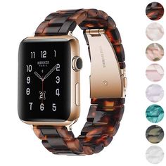 an apple watch with brown tortoise shell band and gold tone case, on a white background