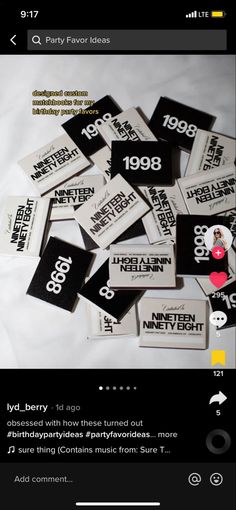 a pile of black and white stickers sitting on top of a bed next to each other