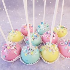 there are many cake pops with sprinkles on them