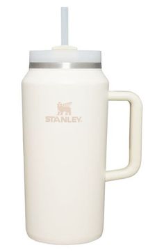 a white travel mug with a straw in the top and an insulated lid is shown against a white background