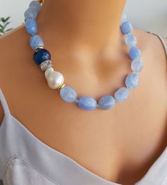 📍 Description :  The handmade necklace has been designed with Baroque Pearl, Quartz gemstone in blue colour and Agate gemstone in dark blue colour.  The colours of the stones may differ slightly in photo shoots caused by lighting and reflections. ✂ Materials : The natural stones used are;  Baroque Pearl, Quartz gemstone in blue colour and Agate gemstone in dark blue colour.   The chain and gold-colored materials used are 14 carat gold plated on brass and do not tarnish. 📐 Dimensions : The neck Handmade Anniversary Gifts, Dark Blue Colour, Princess Necklace, Dark Blue Color, Short Necklace, Blue Colour, Agate Gemstone, Necklace Handmade, Baroque Pearls