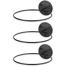 three black circular wall hooks on a white background