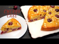 a piece of cherry cake sitting on top of a white plate