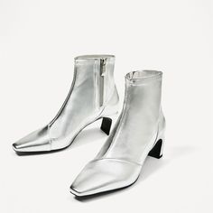 Step out in style with these silver metallic square-toe booties. Featuring a trendy block heel, convenient side zip, and ankle boot design, these boots effortlessly blend fashion and functionality. Color: Silver Material: Metallic finish Heel Type: Block heel Heel height: 2" / 50 mm approx Product measurements were taken using size 8. Please note that measurements may vary by size. Toe: Square toe The side zipper design makes it easier to wear. Handcrafted US sizing. Fits true to size. Boots Low Heel, Trendy Block Heels, Square Toe Ankle Boots, Cowboy Shoes, Short Ankle Boots, Boots Square Toe, Custom Boots, Pointy Toe Flats, Chunky Heels Boots