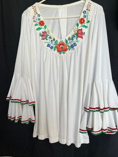 Hand painted white top / tunic Hungarian Kalocsa design  The sleeves bottom got  red-white -green hand embroidered lace Size XXL White Folk Style V-neck Blouse, White Casual Tunic With Floral Embroidery, White Bohemian Embroidered Tunic Top, Casual Embroidered White Tunic, Bohemian White Embroidered Tunic Top, Casual White Embroidered Tunic, White Embroidered Tunic Top, White Summer Folk Style Tunic, White Summer Folk Tunic