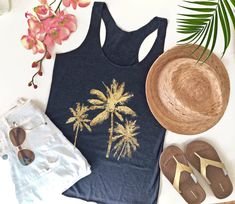 This Palm Tree beach tank top makes a great beach lovers gift. A beach tshirt with palm trees is beach chic and gives you a feeling of being on the beach, in the warm tropical breeze. Close your eyes and picture the swaying palm trees and the soft sand underfoot. Awww... This racerback tank is a tri-blend. It is soft, lightweight, and form-fitting with a flattering cut. 50% polyester/25% combed ring-spun cotton/25% rayon -- This tri-blend combination is the perfect blend for super soft and durab Palm Tree Shirt, Beach Tshirt, Chic Tank Tops, Palm Tree Beach, Beach Tanks Tops, Beach Tanks, Palm Trees Beach, Beach Lover Gifts, Vacay Mode