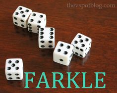 four white dices sitting on top of a wooden table with the words farkle written above them