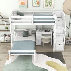 there is a bunk bed with a desk underneath it and drawers below the bedspread