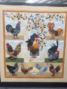 a quilted wall hanging with roosters and hens on it's sides