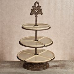 three tiered cake stand with ornate design