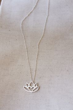 An original Lola&Cash protea necklace featuring a hidden heart -- d e t a i l s -- -protea measures 2cm wide -hand sawn out of solid sterling silver -completed in a mirror finish -includes a 45cm chain This pendant is also available in gold as seen in last picture https://www.etsy.com/listing/621948340/gold-protea-pendant-solid-9ct-yellow?ref=shop_home_active_1 -All Lola&Cash jewellery will arrive gift wrapped ---------------------------------------- Please Note - Made to order - Rush or Delicate Silver Charm Necklace For Mother's Day, Silver Flower Charm Necklace With Delicate Chain, Silver Flower Charm Necklaces With Delicate Chain, Delicate Silver Necklace For Meditation, Delicate Silver Flower-shaped Charm Necklace, Delicate Silver Flower Shape Charm Necklace, Dainty Flower Pendant Jewelry For Meditation, Silver Flower Charm Necklace For Gift, Delicate Handmade Silver Charm Necklaces