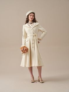 "Always traveling from one place to another? You need a coat that can handle any weather. With a hooded design, this wool coat is the perfect solution. Crafted from Premium wool, this piece is detailed with a distinct asymmetrical front fastening that will add an extra touch of elegance to your collection. Undoubtedly your new favourite. Create a timeless and versatile addition in soft tones.Grounded with practical elements such as the two two deep pockets, a single-breasted design, a classic hood. The detachable belt creates a sleek silhouette that offers multiple styling options. We've upgraded the wool fabric and used a handmade composite lining to enhance comfort. Even on the coldest days, you can stay elegant and chic in our coat, giving you with the perfect blend of functionality and White Belted Winter Outerwear, Winter Cream Single Breasted Wool Coat, White Wool Coat For Winter, Cream Single Breasted Pea Coat For Winter, Cream Single-breasted Pea Coat For Winter, Classic Cream Wool Coat For Winter, Classic Cream Pea Coat For Winter, Cream Fitted Long Wool Coat, Fitted Long Cream Wool Coat