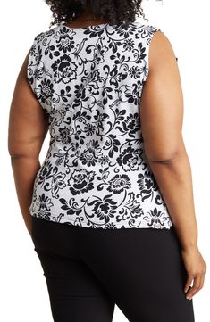 A bold pattern adds eye-catching appeal to a sleeveless top that's perfect for dressing up for a day at the office. 26" length (size 1X) Surplice V-neck Sleeveless 92% cotton, 8% spandex Machine wash, tumble dry Imported Model stats: 5'10" height, 32" bust, 25" waist, 36" hip. Model is wearing size 1X. Patterned Sleeveless Blouse, Casual Sleeveless Tops With Bold Print, Sleeveless Stretch Blouse With Floral Print, Sleeveless Stretch Patterned Tops, Patterned Stretch Sleeveless Top, Patterned Sleeveless Stretch Top, Stretch Sleeveless Patterned Top, Fitted Sleeveless Printed Blouse, Multicolor Print Fitted Sleeveless Top