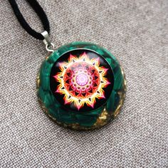 Malachite Flower Of Life EMF Protection Orgonite Necklace – Gofaer Crystal Orgonite store! Spiritual Green Round Jewelry, Green Amulet Round Necklace, Green Round Amulet Necklace, Green Amulet Style Round Necklace, Green Locket Jewelry For Gift, Green Symbolic Pendant Necklace, Green Necklace With Round Pendant For Healing, Green Round Locket Necklace, Green Locket Necklace With Round Pendant