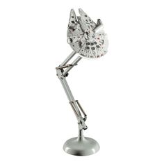 a silver metal desk lamp with a star wars character on it's head and arms