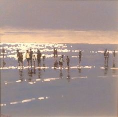 a group of people riding horses on top of a beach next to the ocean at sunset