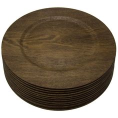 a stack of brown wooden plates sitting on top of each other in front of a white background