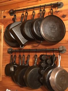 pots and pans are hanging on the wall