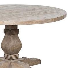 a round wooden table sitting on top of cement blocks