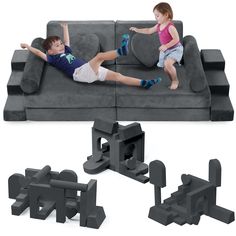 two children are laying on a couch with letters and blocks in the shape of letters