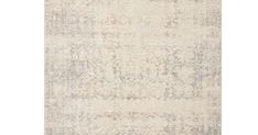 an antique rug with faded colors on the bottom, and a white background in blue