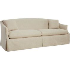 a beige couch sitting on top of a white floor