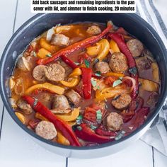 a pan filled with meatballs and peppers